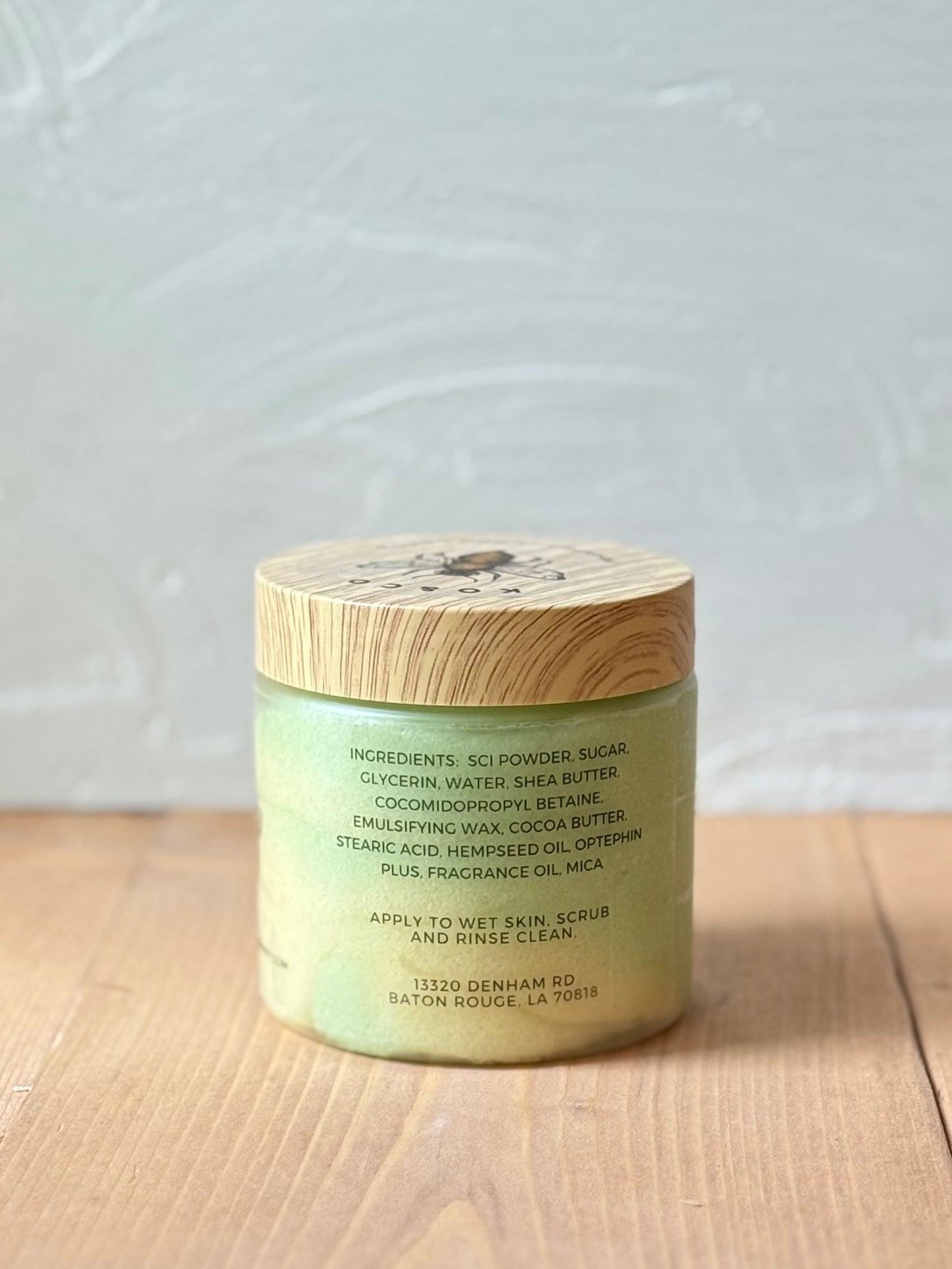 Jar of whipped foaming sugar scrub with a smooth, creamy texture