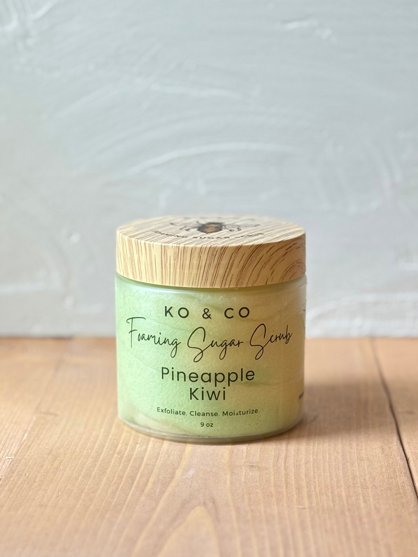 Jar of whipped foaming sugar scrub with a smooth, creamy texture