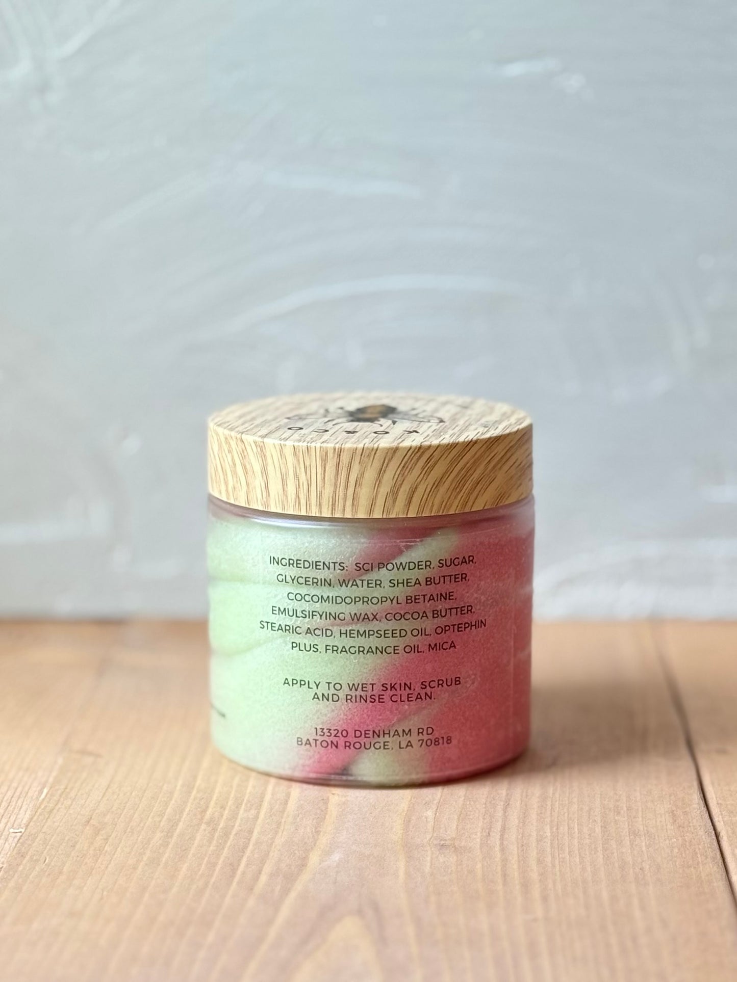 Jar of whipped foaming sugar scrub with a smooth, creamy texture