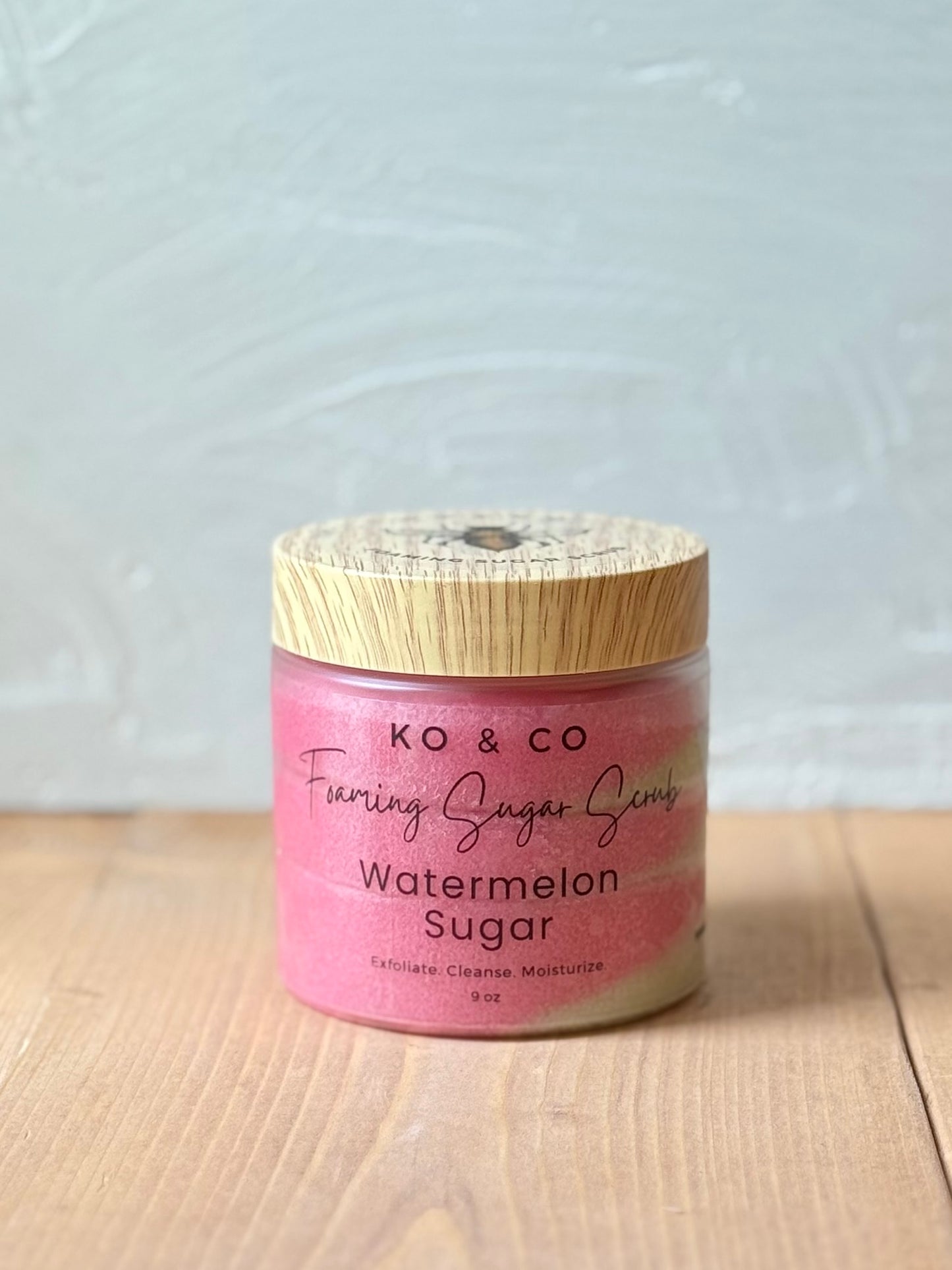 Jar of whipped foaming sugar scrub with a smooth, creamy texture