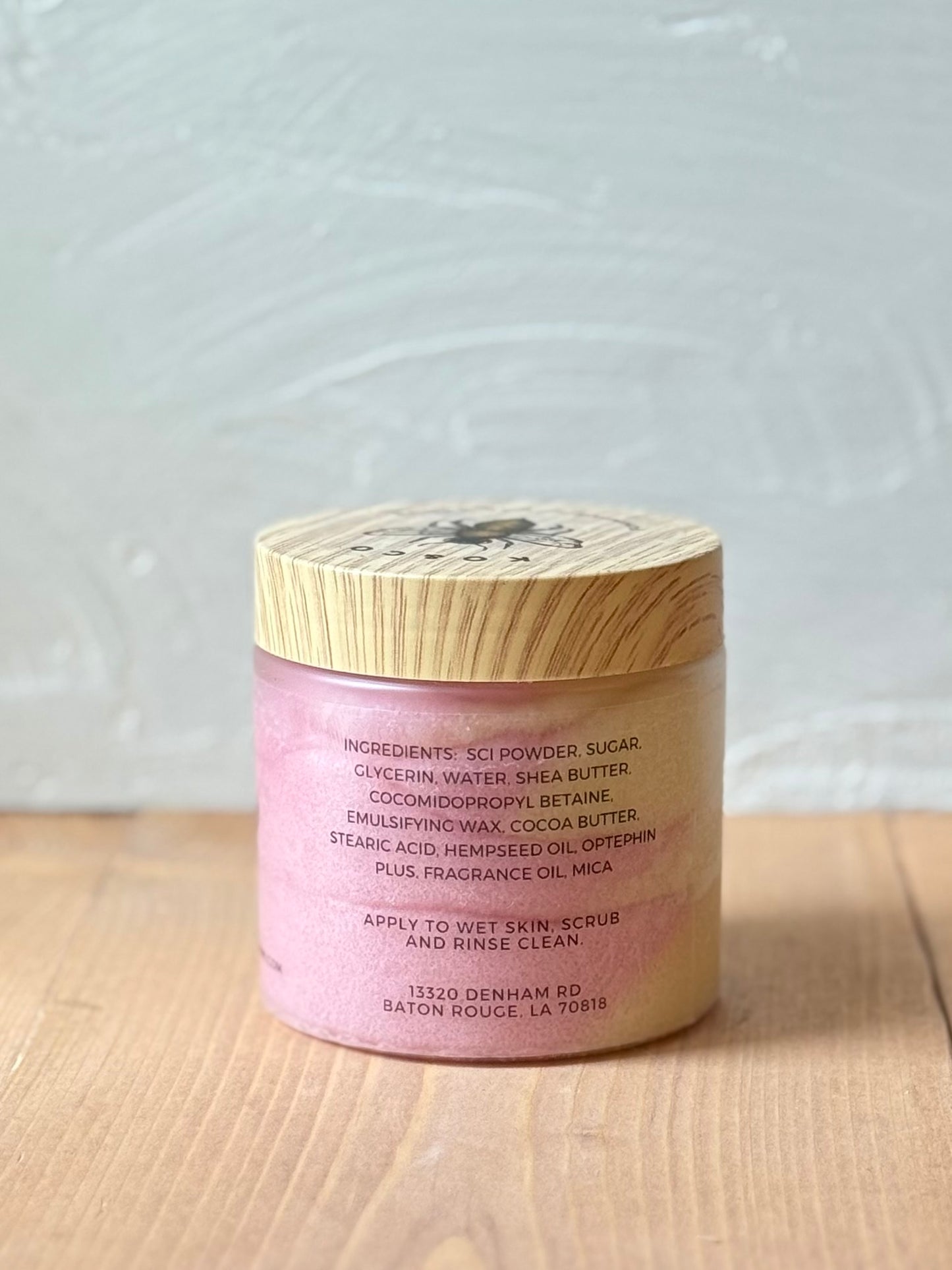 Jar of whipped foaming sugar scrub with a smooth, creamy texture