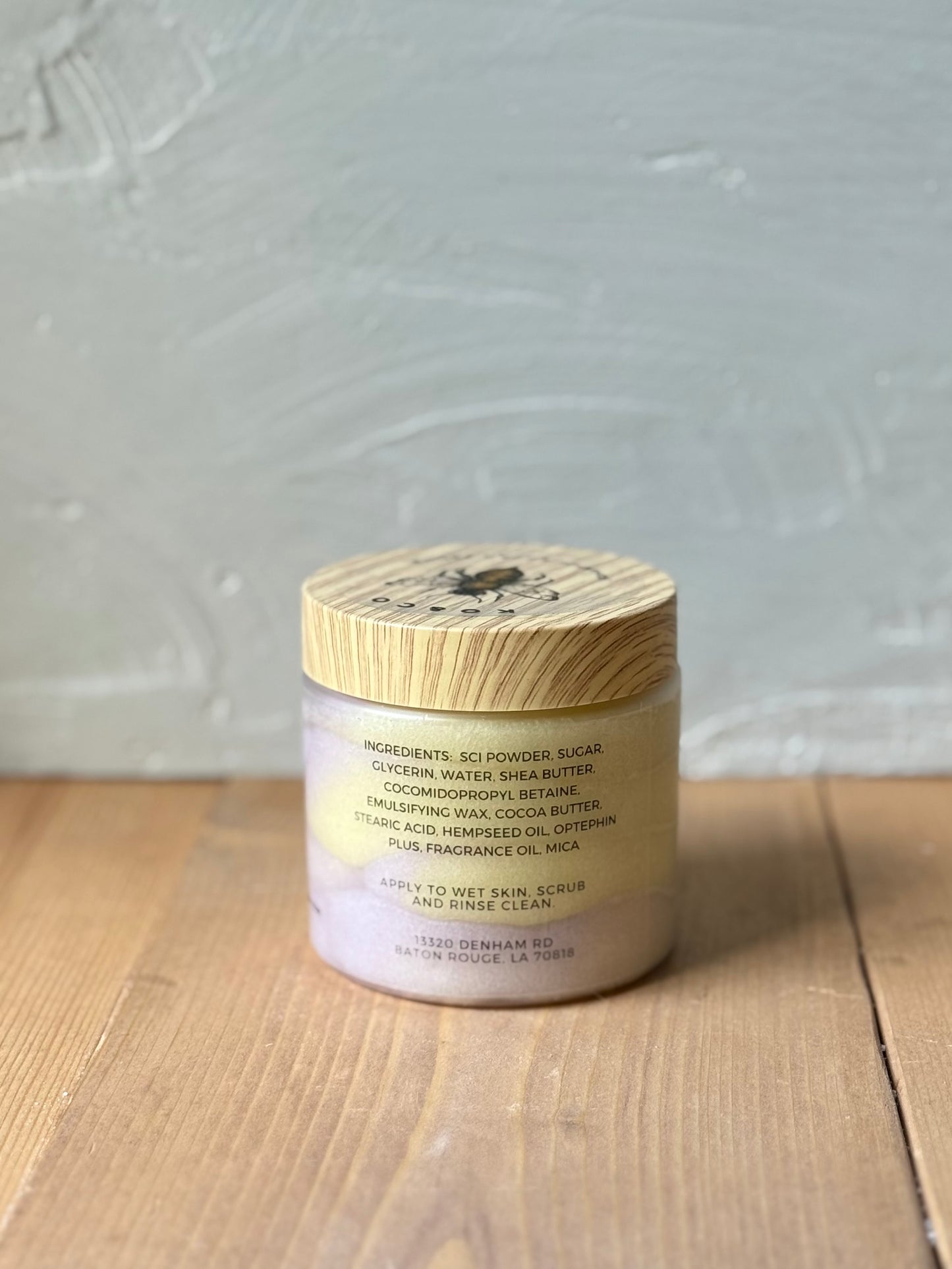 Jar of whipped foaming sugar scrub with a smooth, creamy texture