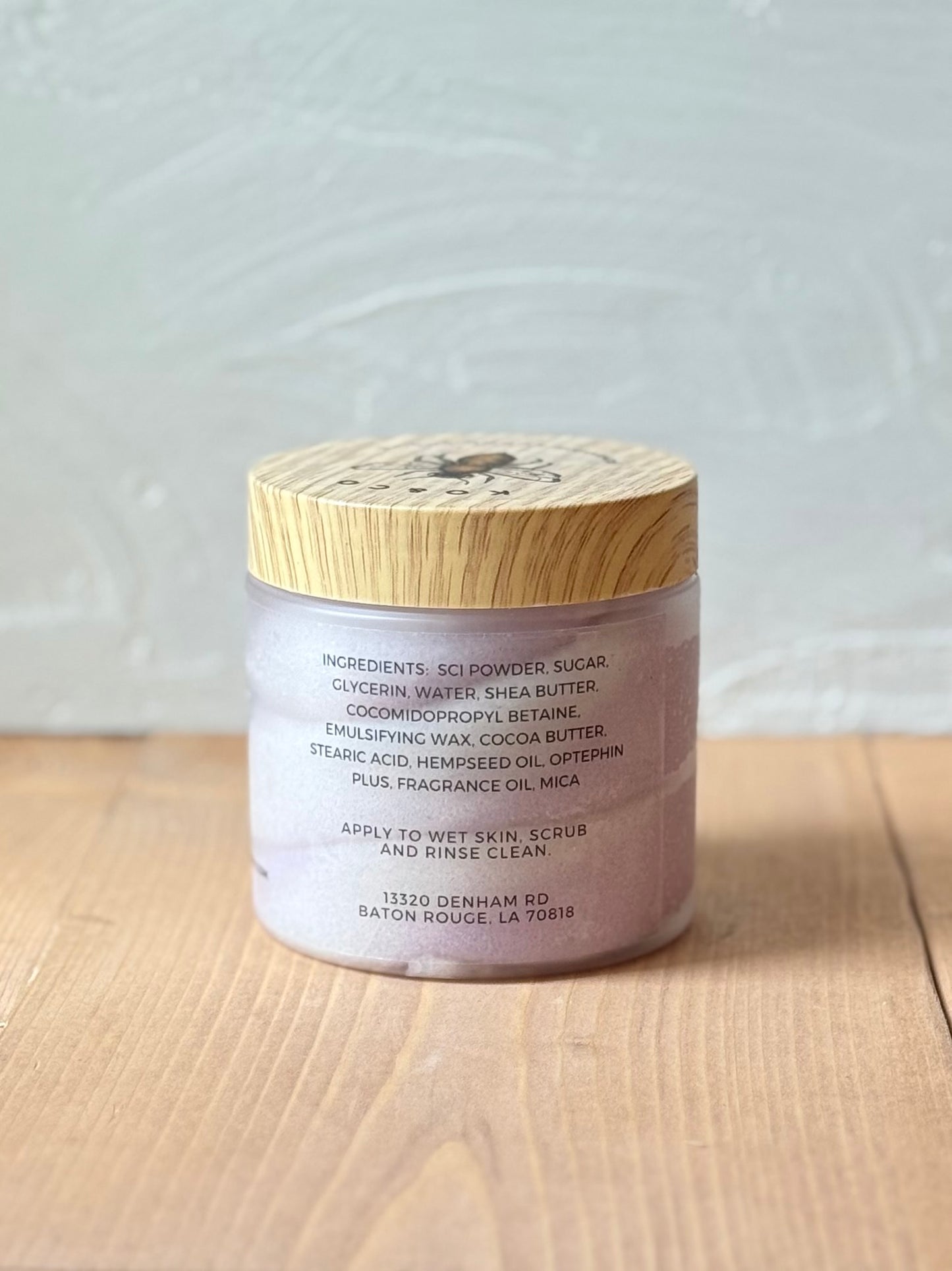 Jar of whipped foaming sugar scrub with a smooth, creamy texture