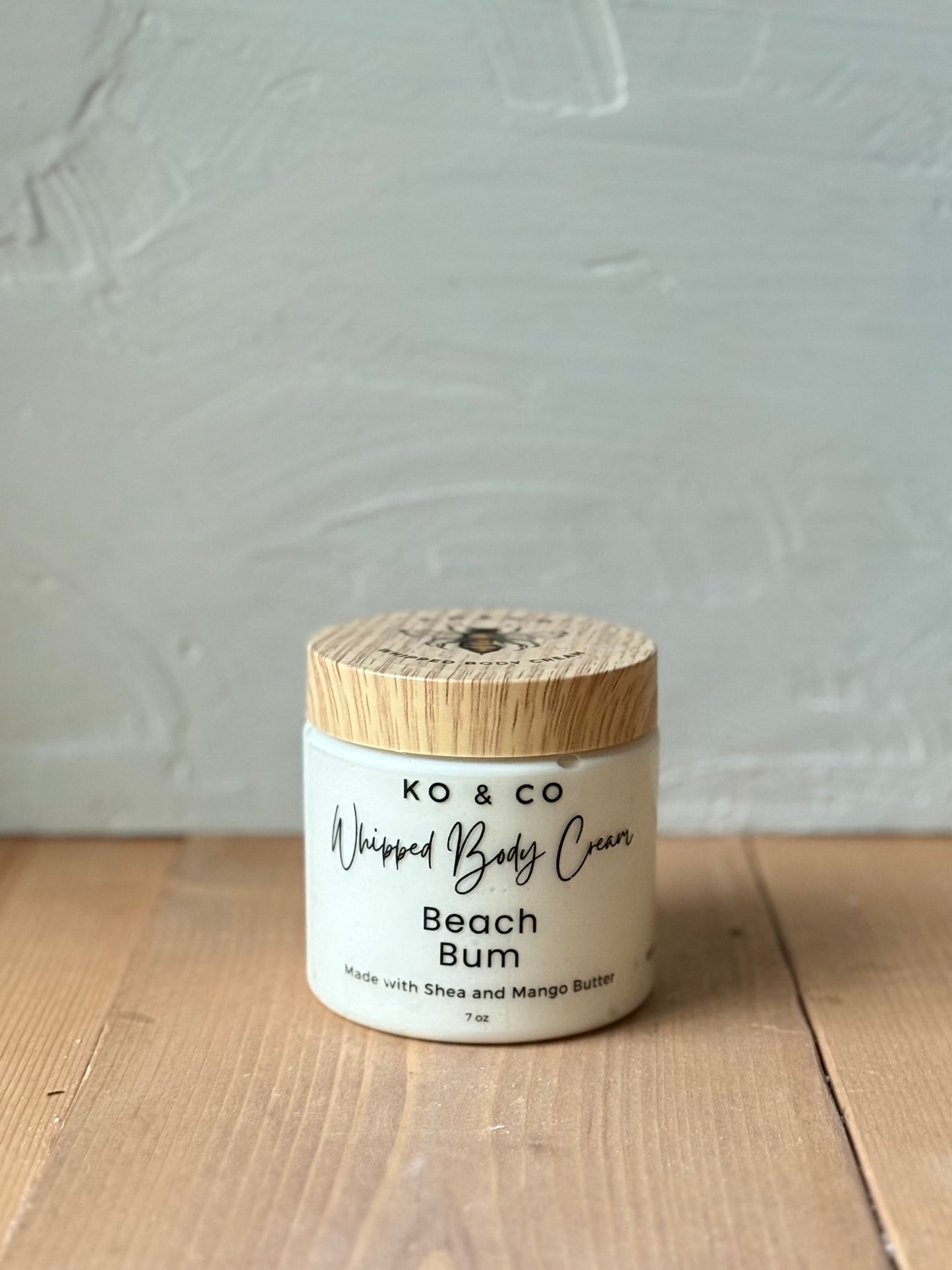 Jar of Beach Bum whipped body butter on wood background