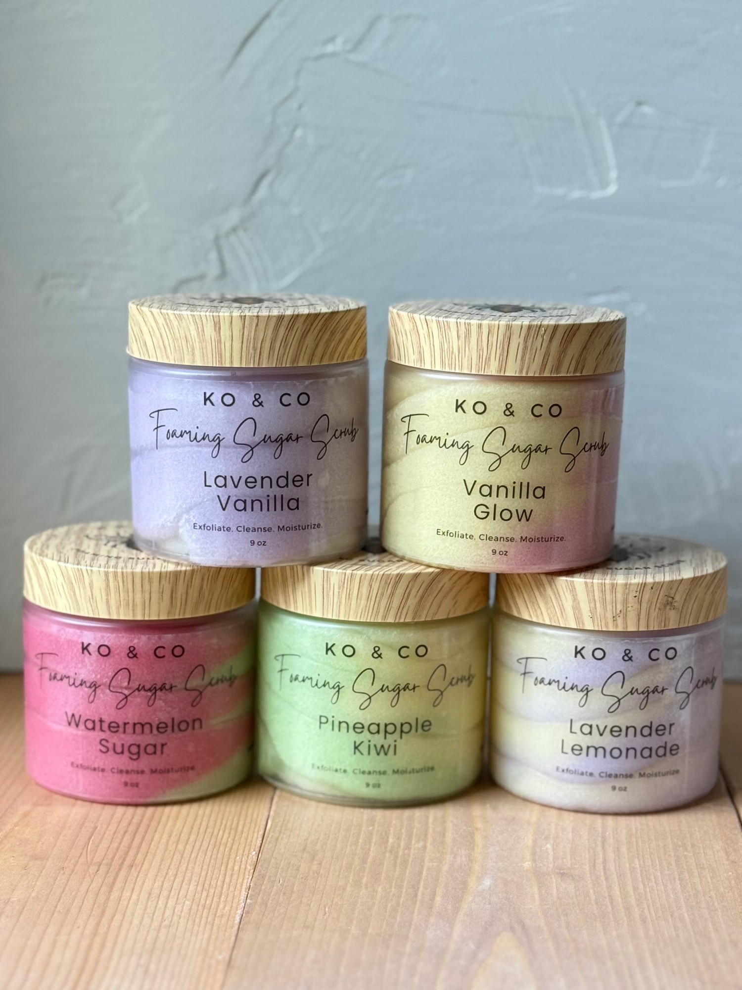 Assortment of natural foaming sugar scrubs in various scents and colors