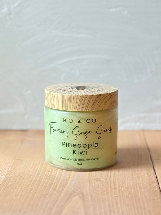 Jar of whipped foaming sugar scrub with a smooth, creamy texture