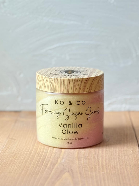 Jar of whipped foaming sugar scrub with a smooth, creamy texture