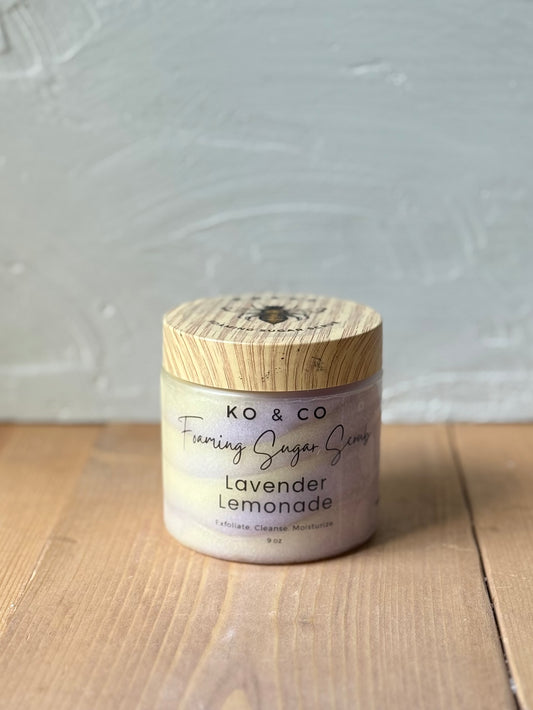 Jar of whipped foaming sugar scrub with a smooth, creamy texture